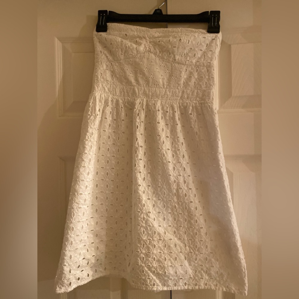 Gently used white, strapless dress. Good for the beach. No Sign of tear or wear